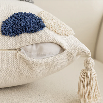 Decorative pillow with blue pom-pom and tassel on a neutral background Nordic blue tufted cushion cover with geometric stripe and grid crochet pattern, tassel pillow cover for sofa, bed, and boho home decor