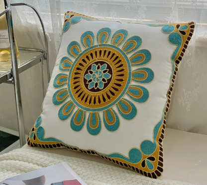 Decorative pillow with intricate design on a couch, floral embroidery on linen cotton cushion cover – boho home decor accent
