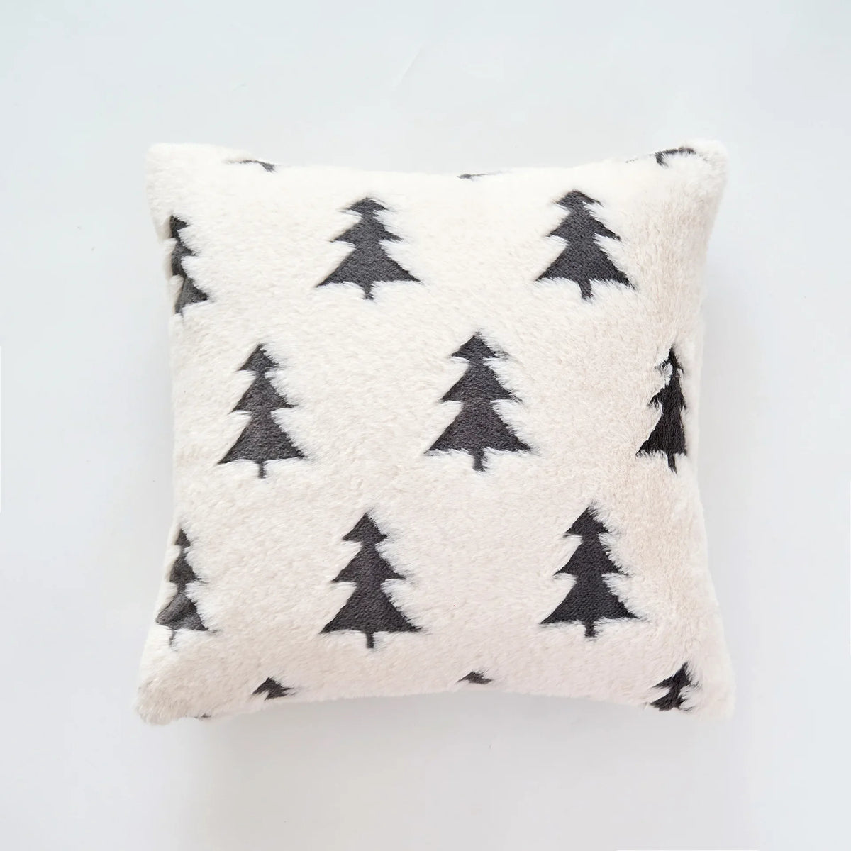 Decorative pillow with gray tree patterns on a light gray background