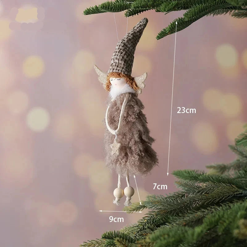 Decorative angel figurine hanging on a Christmas tree with measurements indicated.