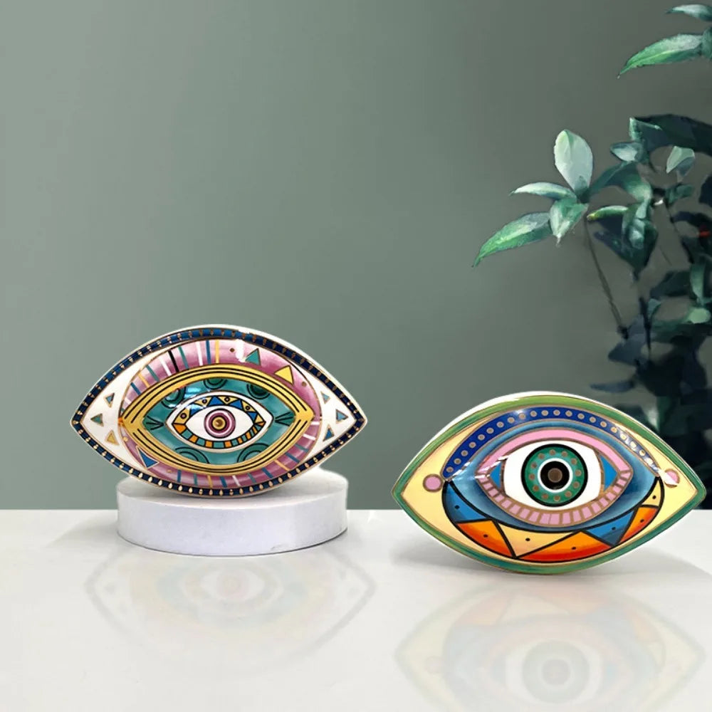 Moroccan Turkish blue evil eye ceramic figurine on display, unique bohemian home decor accent perfect for eclectic and boho home styles, adds soulful vibes and a cozy touch to any room, great for gifting as a boho home decor gift or housewarming present.