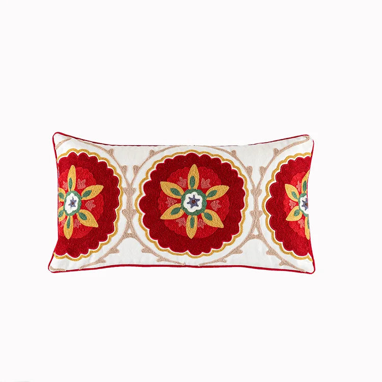 Decorative pillow with red and gold floral patterns on a white background. Bohemian embroidered throw pillow cover with geometric design, cotton-blend cushion for sofa, bed, or modern home decor.
