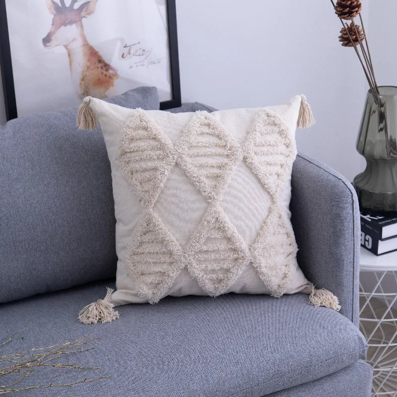 Decorative pillow with geometric pattern on a gray sofa