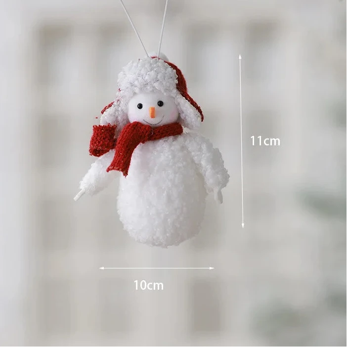Snowman ornament with red scarf hanging from a branch, with measurements indicated.