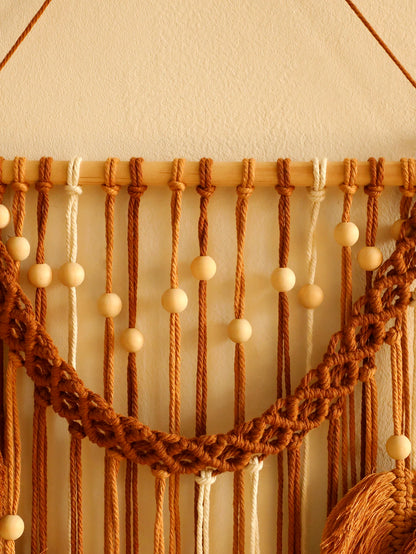 Macrame wall hanging with wooden beads on a neutral background