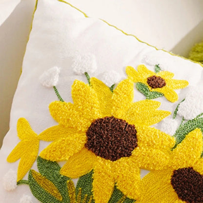 Decorative pillow with sunflower pattern on a white background