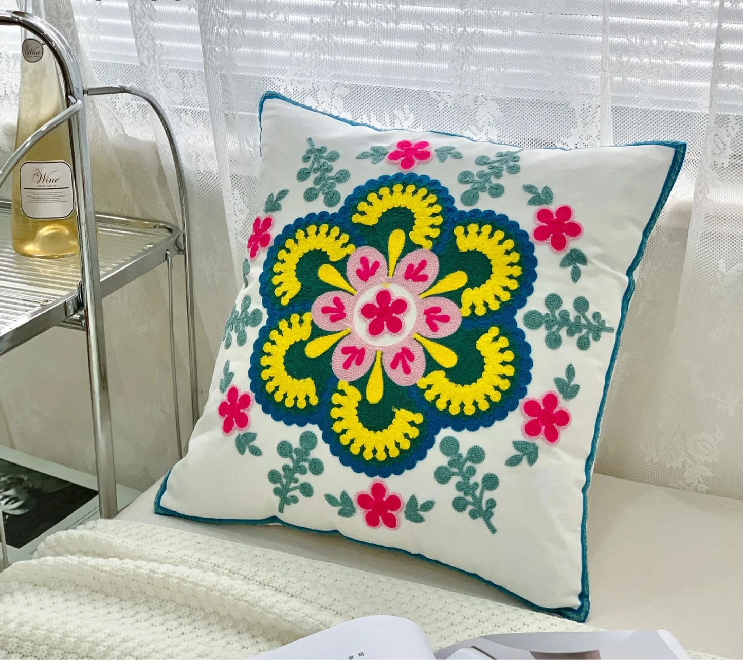 Decorative pillow with floral pattern on a couch, floral embroidery on linen cotton cushion cover – boho home decor accent