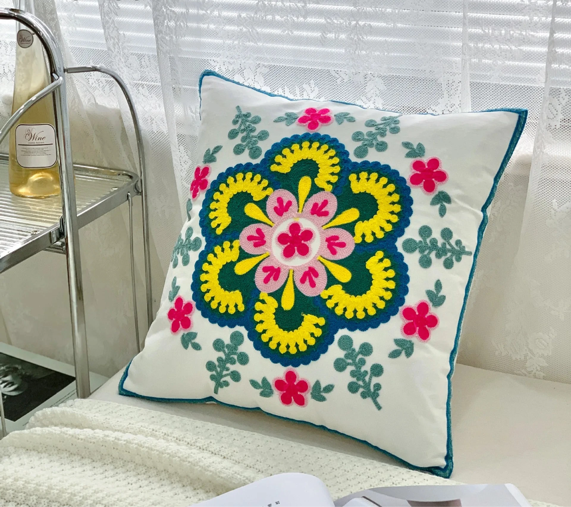 Decorative pillow with floral pattern on a couch, floral embroidery on linen cotton cushion cover – boho home decor accent