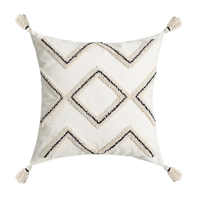 Decorative pillow with geometric pattern and tassels on a white background Nordic blue tufted cushion cover with geometric stripe and grid crochet pattern, tassel pillow cover for sofa, bed, and boho home decor