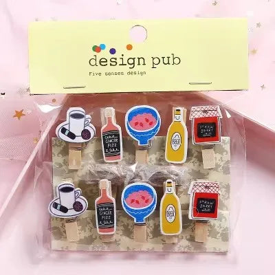 Packaged set of decorative items with 'design pub' branding on a pink background