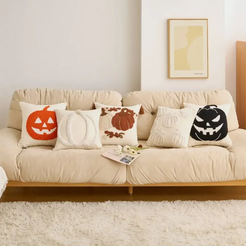 Beige sofa with Halloween-themed cushions in a living room setting. Tufted pumpkin pillow cover 18x18 inch Halloween sofa and bed decor