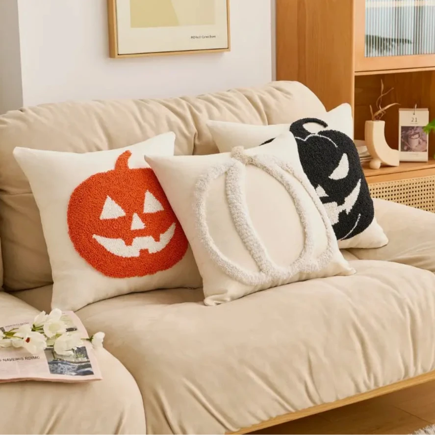 Beige sofa with Halloween-themed cushions including a pumpkin and ghost design, in a cozy living room setting. Tufted pumpkin pillow cover 18x18 inch Halloween sofa and bed decor