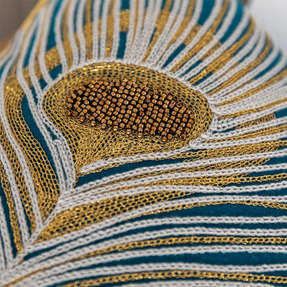 Close-up of a decorative fabric with gold and blue patterns. Bohemian embroidered throw pillow cover with geometric design, cotton-blend cushion for sofa, bed, or modern home decor.