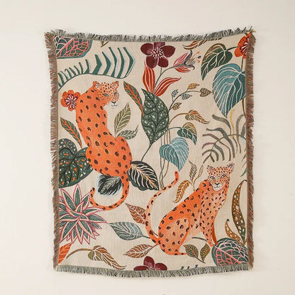 Decorative throw blanket with leopards and floral patterns on a beige background. Boho Home Decor. 