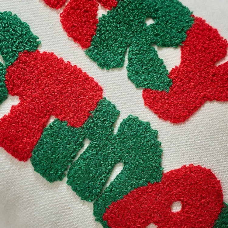 Close-up of red and green textured letters on a white background
