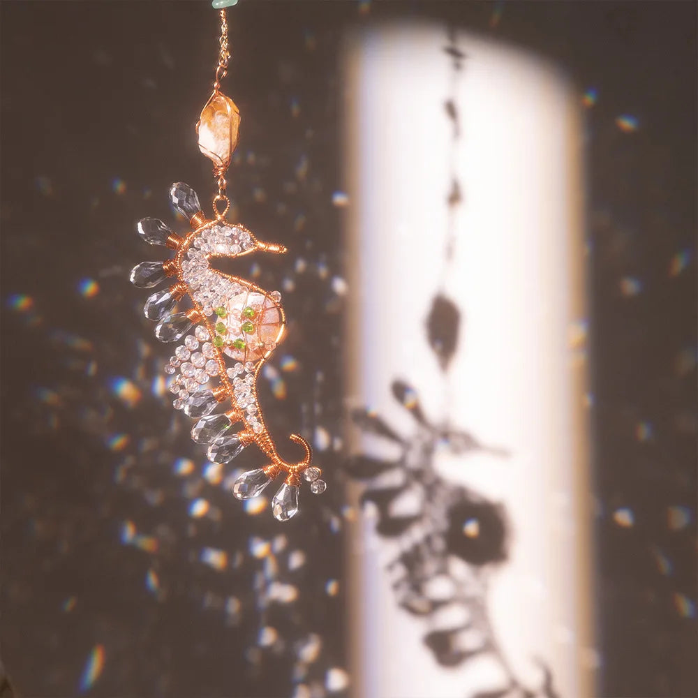 Decorative seahorse ornament with gemstones hanging against a blurred background boho home decor, crystal wind chime, sun catcher for windows, moon prism chime, agate stone hanging, garden art decor, patio hanging decoration, boho housewarming gift, spiritual gift, crystal suncatcher, balcony decor, meditation decor, handmade crystal chime