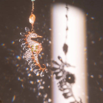 Decorative seahorse ornament with gemstones hanging against a blurred background boho home decor, crystal wind chime, sun catcher for windows, moon prism chime, agate stone hanging, garden art decor, patio hanging decoration, boho housewarming gift, spiritual gift, crystal suncatcher, balcony decor, meditation decor, handmade crystal chime
