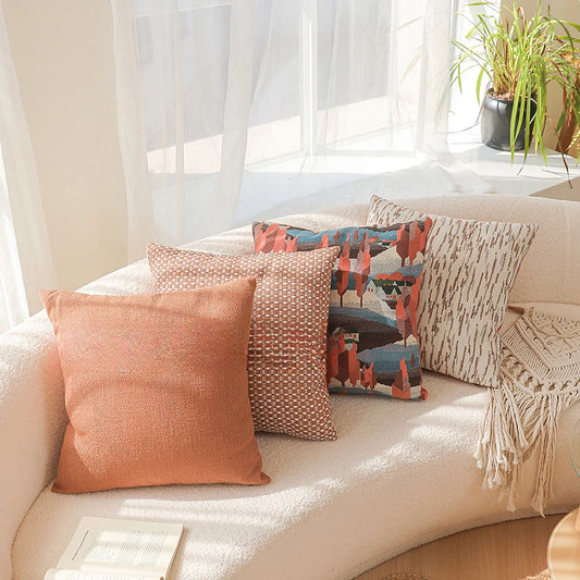 Decorative pillows on a beige sofa with a neutral background. Modern yarn-dyed throw pillow cover, luxury textured decorative cushion for sofa, bed, or window seating in soft neutral tones.