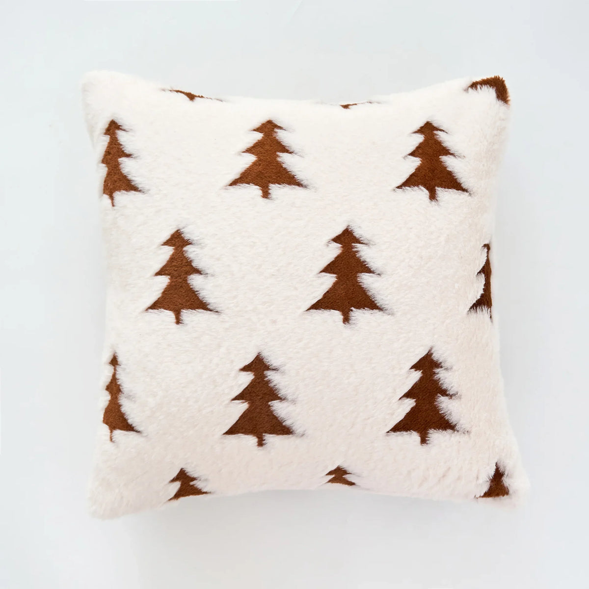 Decorative pillow with brown tree pattern on a light gray background