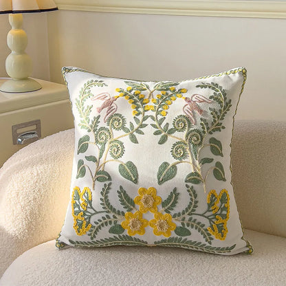 Decorative pillow with floral embroidery on a couch