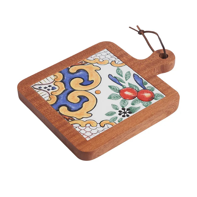 Decorative cutting board with ceramic tile design on a white background