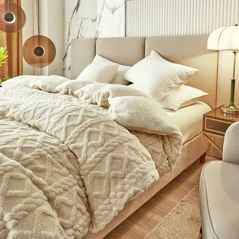 Neatly made bed with textured duvet and pillows in a bedroom setting. Soft plush duvet cover and blanket in solid color with striped jacquard design, dual-use artificial cashmere fleece bedding for cozy winter warmth.