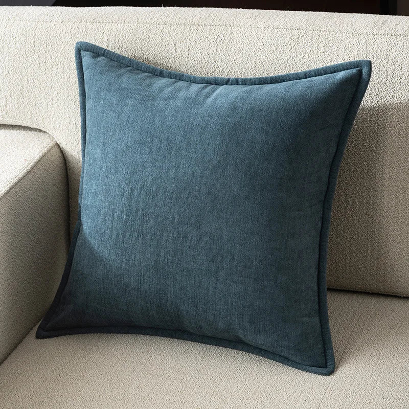 Blue pillow on a beige sofa