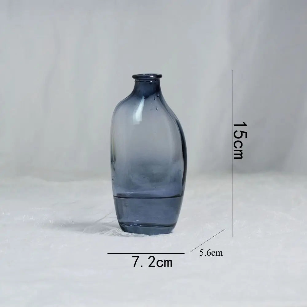 Blue glass vase with dimensions on a white background