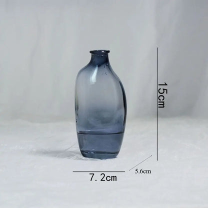 Blue glass vase with dimensions on a white background