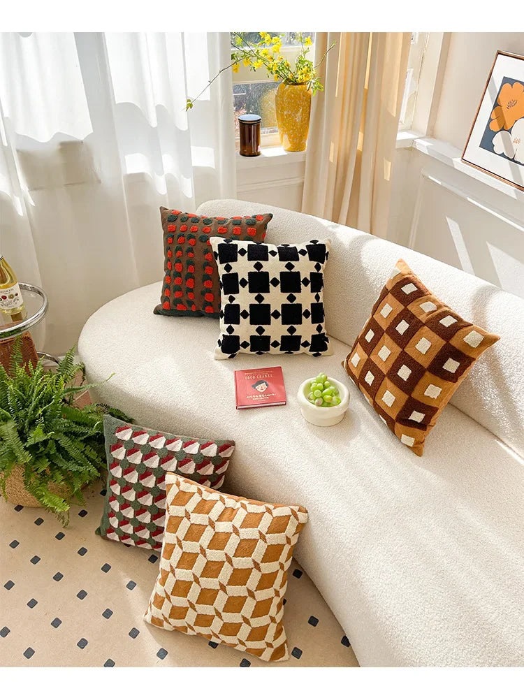Decorative pillows on a white sofa with a homey decor setting. Bohemian embroidered throw pillow cover 18x18 inch with geometric towel embroidery, decorative cushion for sofa, bed, or living room boho home decor