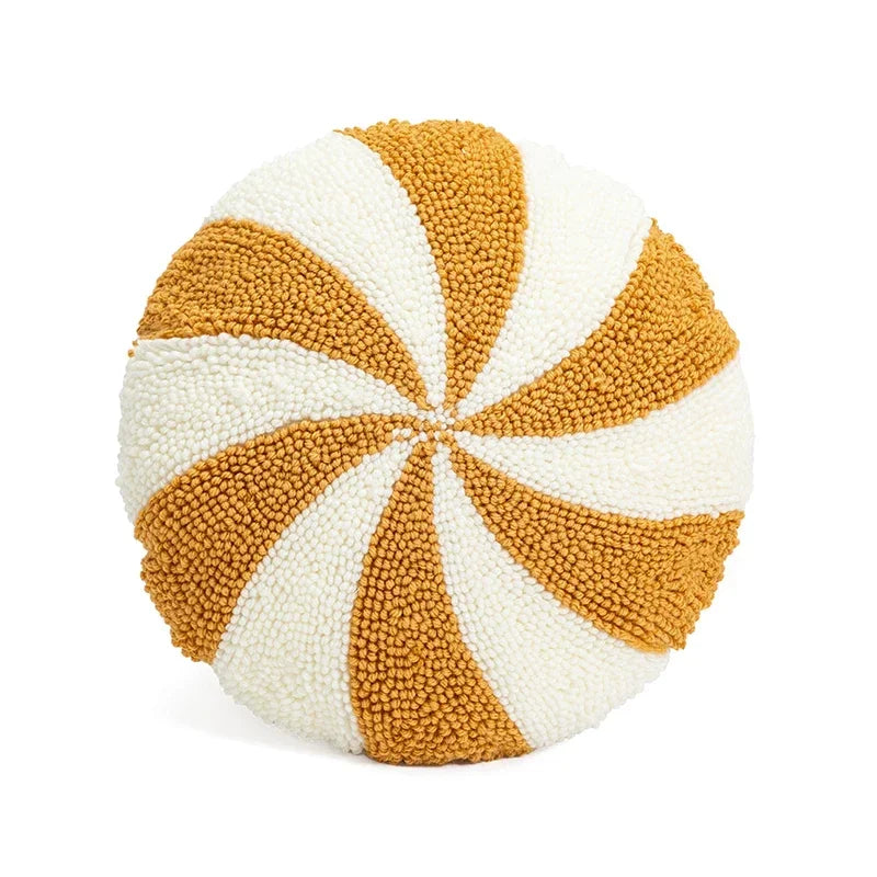 Round pillow with gold and white spiral pattern on a white background