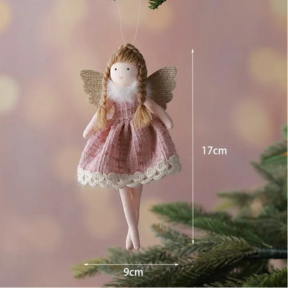 Decorative angel figurine hanging on a branch with measurement details.