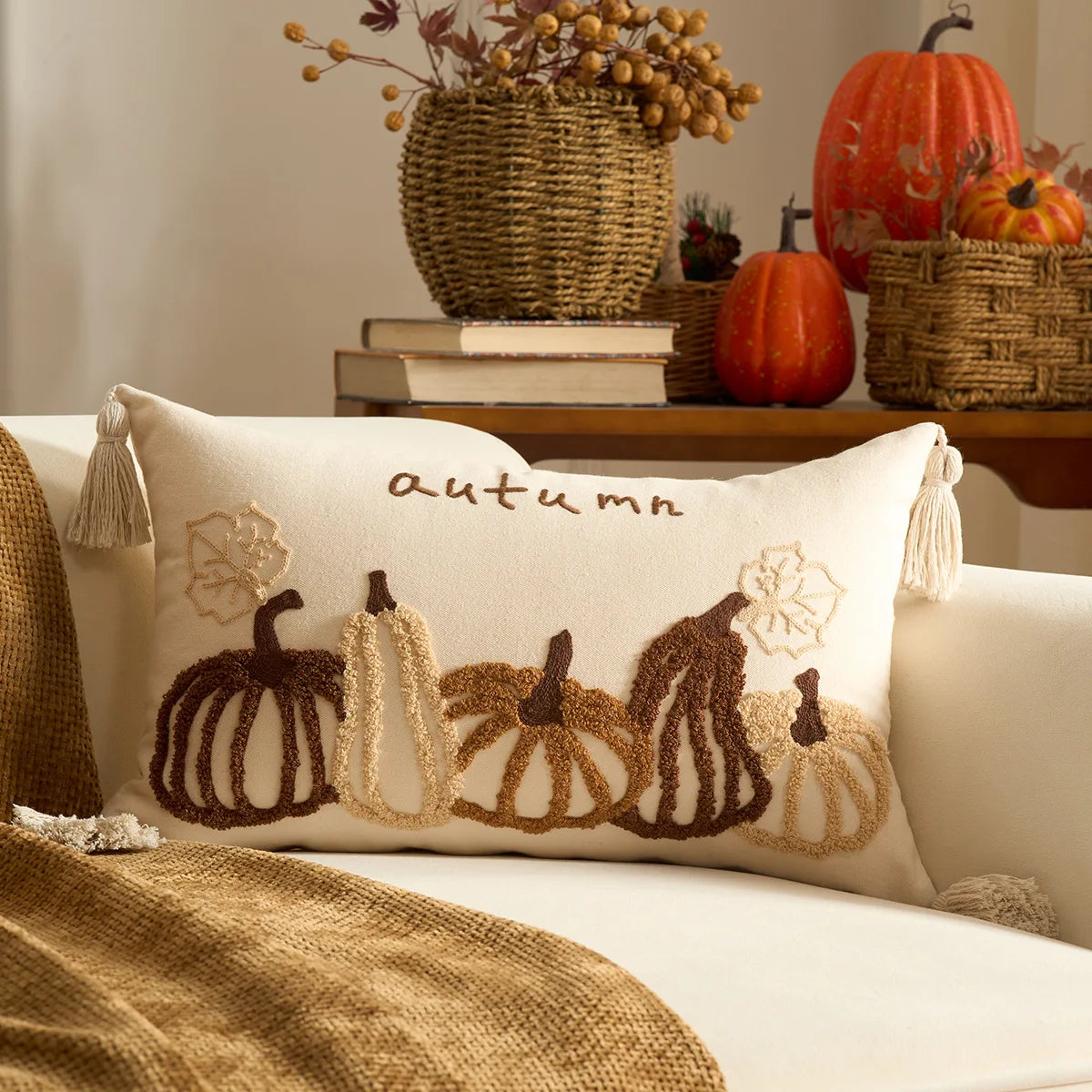 Decorative pillow with autumn design on a couch, surrounded by pumpkins and baskets. Halloween and Thanksgiving decorative pillow cover For Fall