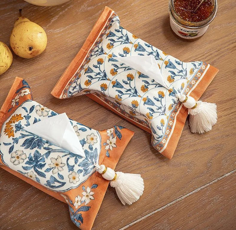 Decorative tissue holder with floral design on a wooden surface boho home decor, reusable tissue bag, cotton tassel tissue holder, plush tissue organizer, bathroom tissue box cover, car tissue case, American style tissue pouch, soft fabric tissue holder, decorative tissue box, housewarming gift, eco-friendly storage