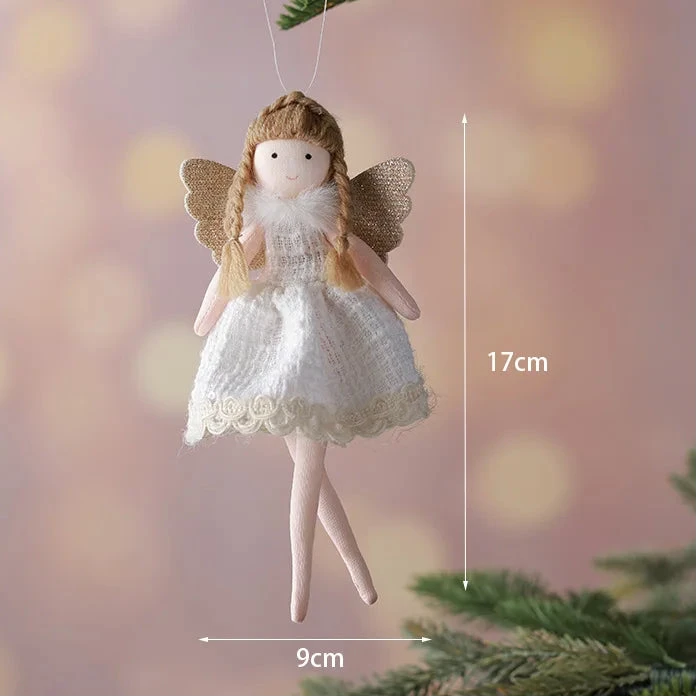 Decorative angel figurine with wings hanging on a branch, with measurements indicated.