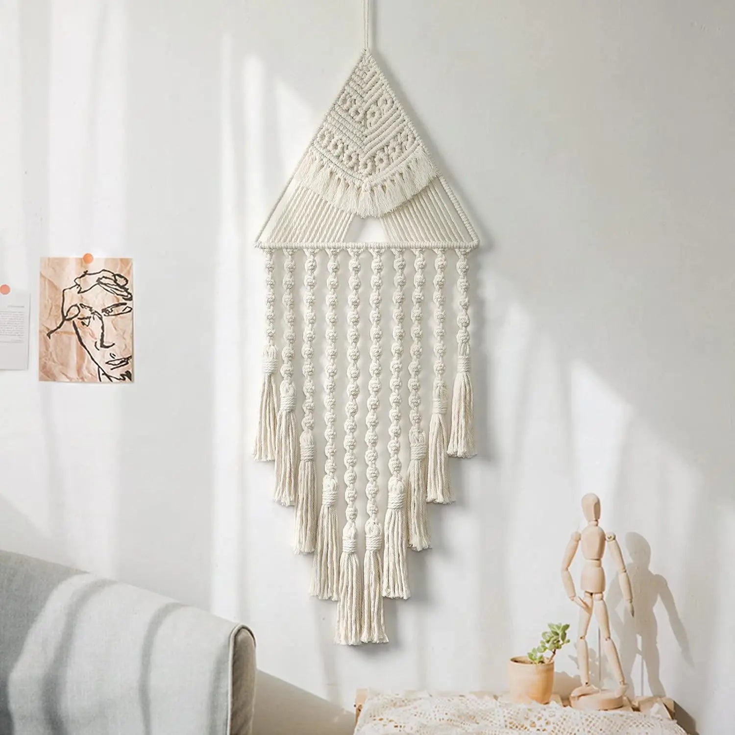 Macrame wall hanging on a white wall with minimal decor boho home decor, macrame wall hanging, triangle dream catcher, woven tapestry, handmade cotton wall decor, tassel wall hanging, bedroom door decor, housewarming gift, rustic bohemian art, boho apartment wall decor, neutral textile art