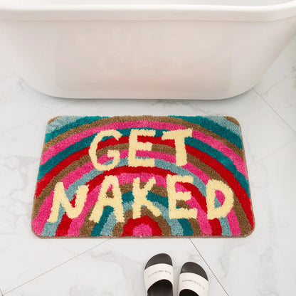 Colorful bath mat with 'GET NAKED' text on a bathroom floor. boho home decor, bathroom rug, tufted bath mat, Get Naked rug, colorful shower mat, apartment decor, dorm bathroom accessories, housewarming gift, microfiber bath mat, fun bathroom rug, American style bath mat