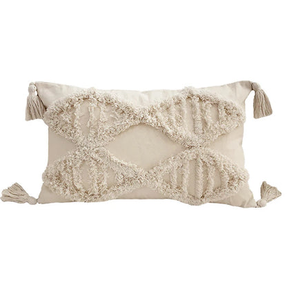 Decorative pillow with tassels on a white background