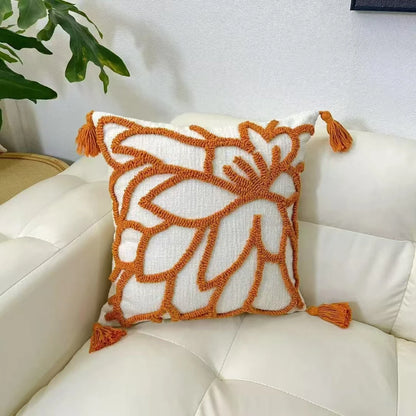 Decorative pillow with orange patterns and tassels on a white couch boho home decor, housewarming gift, chenille pillow cover, geometric cushion case, Nordic pillowcase, velvet throw pillow, sofa cushion, bedroom pillow cover, modern jacquard cushion, decorative car pillow, textured home decor, looped velvet pillow