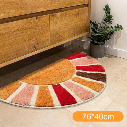Colorful half-circle rug on a tiled floor next to wooden furniture. boho home decor, sunflower door mat, half circle rug, plush entry mat, non-slip bath mat, boho floor mat, floral floor rug, bathroom rug, farmhouse decor, cozy home gift, housewarming gift, living room mat, pastel home accents, cute doormat