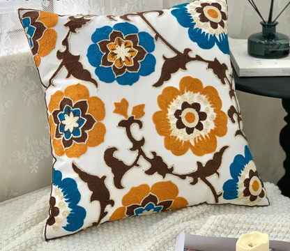Decorative pillow with floral pattern on a couch, floral embroidery on linen cotton cushion cover – boho home decor accent