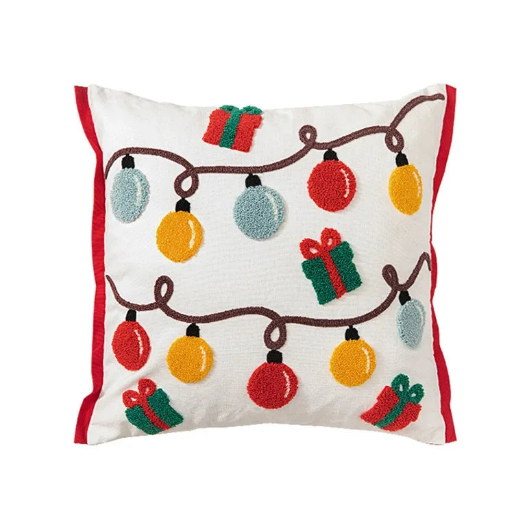 Decorative pillow with Christmas lights and presents on a white background