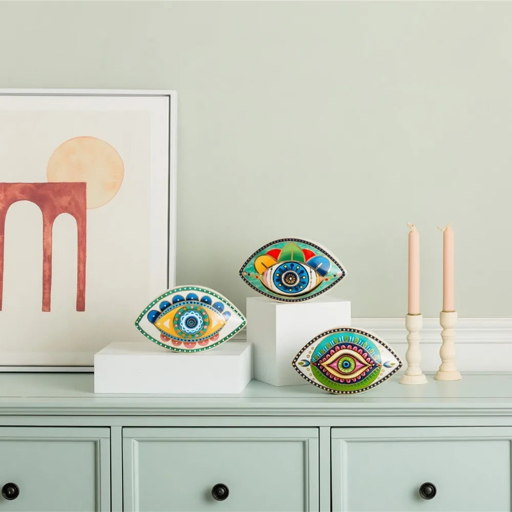 Moroccan Turkish blue evil eye ceramic figurine on display, unique bohemian home decor accent perfect for eclectic and boho home styles, adds soulful vibes and a cozy touch to any room, great for gifting as a boho home decor gift or housewarming present.