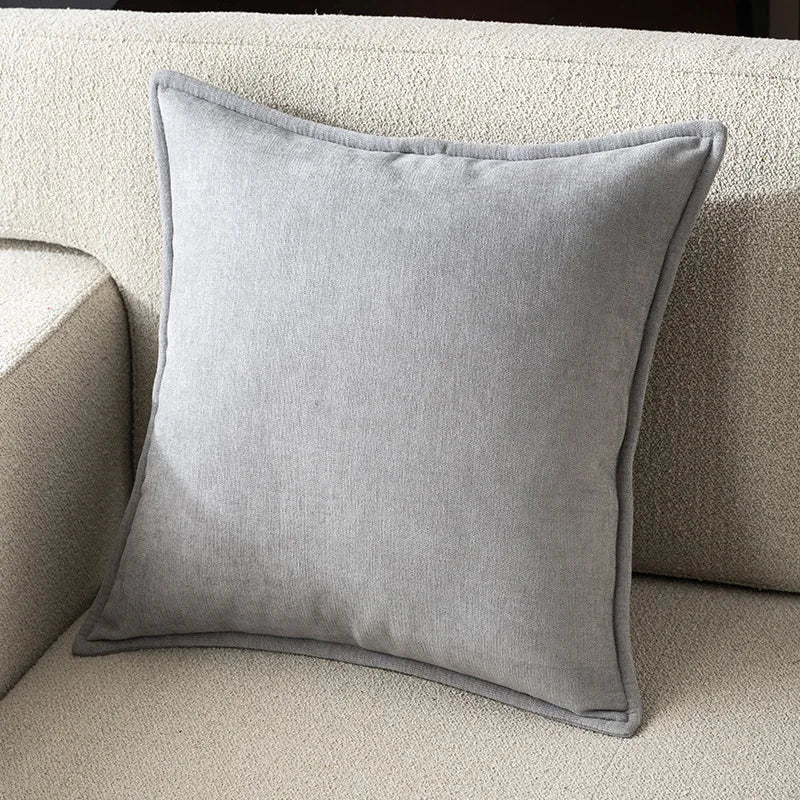 Gray pillow on a beige sofa