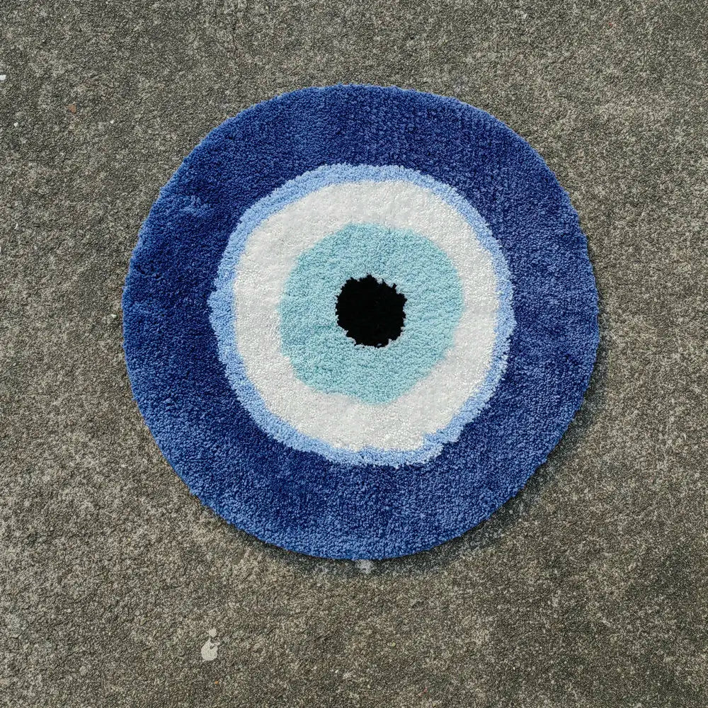 Round blue doormat with concentric circle design on a concrete surface boho home decor, evil eye rug, tufted bathroom rug, fluffy circle rug, plush floor mat, round bath mat, anti-slip mat, dorm decor, Halloween decor, housewarming gift, bathroom accessories, bedroom rug, living room carpet