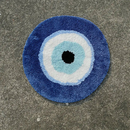 Round blue doormat with concentric circle design on a concrete surface boho home decor, evil eye rug, tufted bathroom rug, fluffy circle rug, plush floor mat, round bath mat, anti-slip mat, dorm decor, Halloween decor, housewarming gift, bathroom accessories, bedroom rug, living room carpet