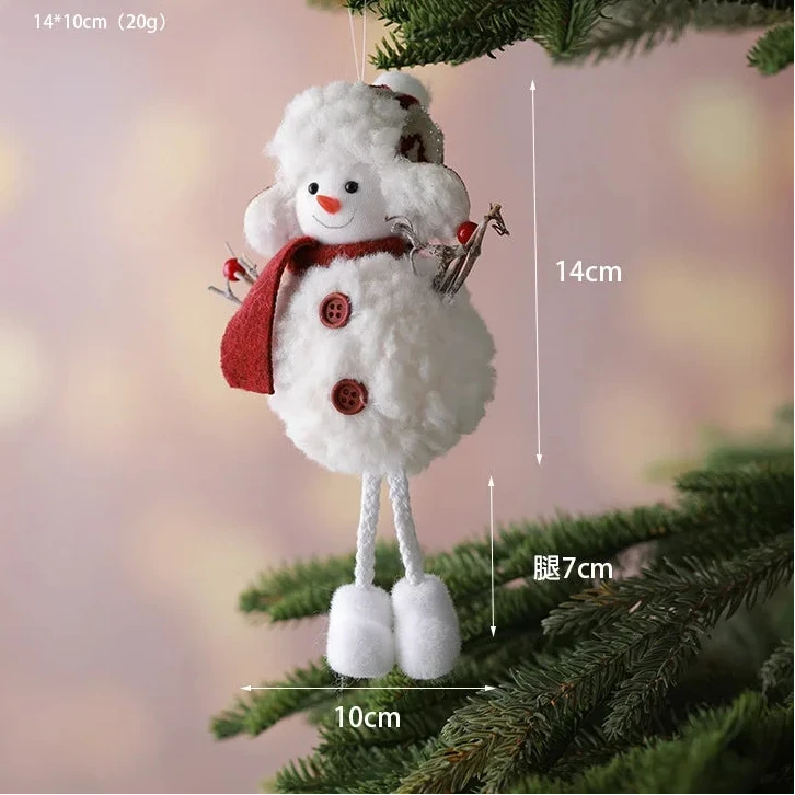 Snowman ornament hanging on a Christmas tree with measurements indicated.