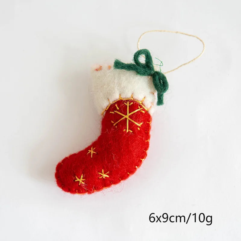 Red and white Christmas stocking ornament with gold snowflake design on a white background.