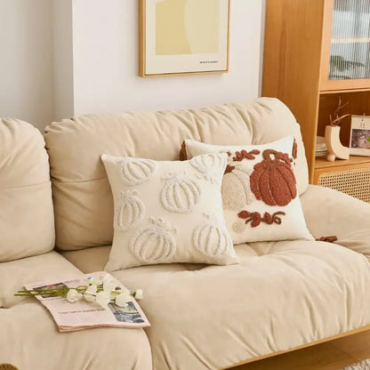 Beige sofa with decorative pillows and a magazine on a light-colored floor. Cartoon pumpkin cushion cover for kids’ room, fall and Halloween decorations