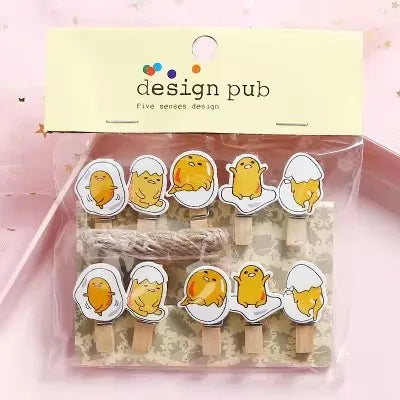 Packaged set of cute animal-themed paper clips with 'design pub' branding.